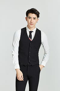 man wearing black vest and white dress shirt thumbnail