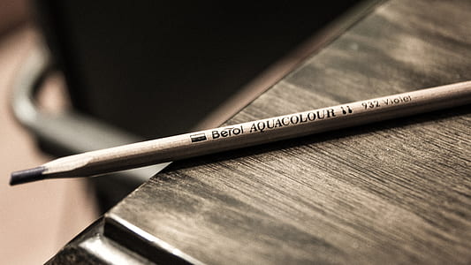 brown and black pencil on table thumbnail