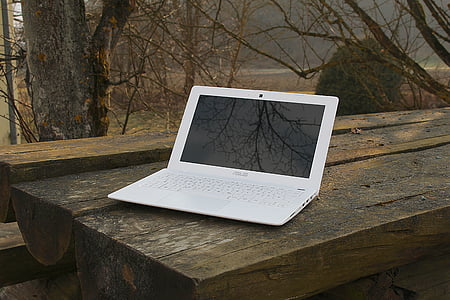 white Asus laptop computer on table thumbnail