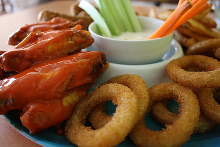 close-up photo of deep-fried onions with seafood on plate thumbnail