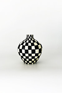 white and black ceramic vase thumbnail