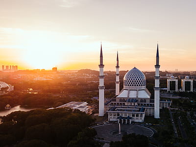 wide angle photo of white concrete building during sunset thumbnail