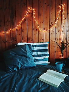 open book page on bed thumbnail