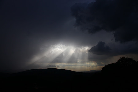 silhouette of mountain under clouds thumbnail