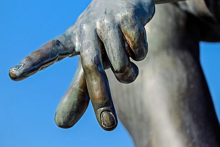 statue's hand during daytime thumbnail