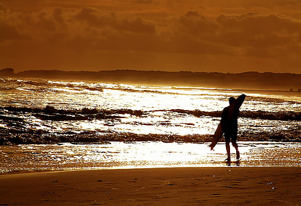 silhouette photography of person with surfboard thumbnail