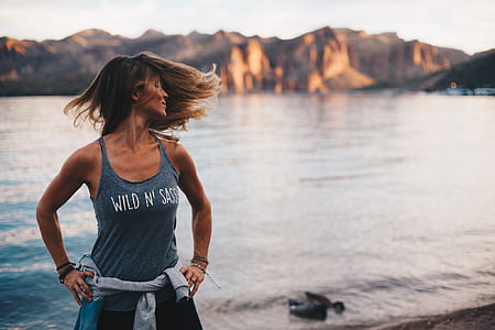 Woman Wearing Grey Wild 'n Sassy Tank Top Near Body of Water thumbnail