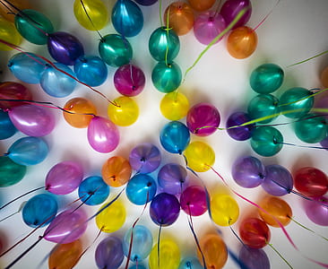 assorted-color balloons on white ceiling thumbnail
