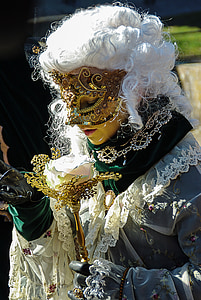 person in brown masquerade mask thumbnail