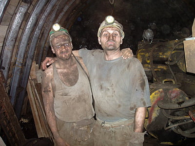 man putting his hand on another man's back thumbnail