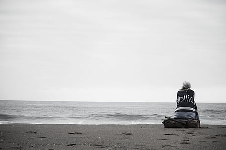 person in black top on seashore thumbnail