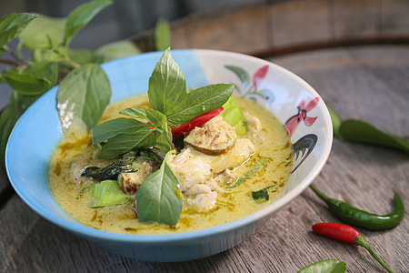curry soup on white ceramic bowl thumbnail