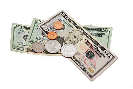 three 20 and 50 U.S. dollar banknotes with coins thumbnail