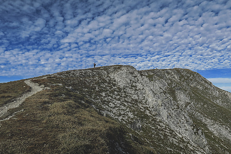 person on top of hill thumbnail