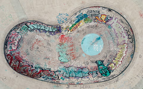 Aerial view of a an empty skateboarding pool colorful graffiti thumbnail