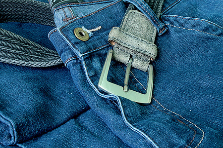 close-up photo of blue denim bottoms and grey belt thumbnail