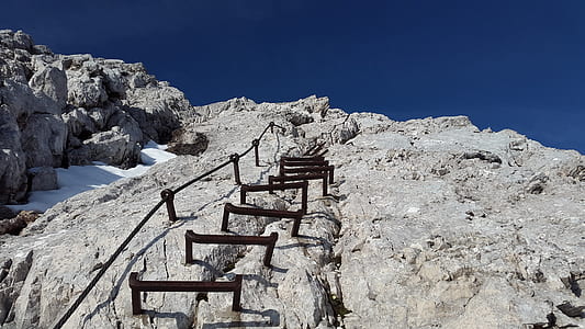 low-angle photography of cliff ladder thumbnail