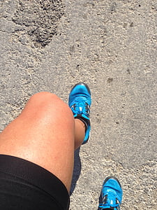 person wearing blue running shoes thumbnail
