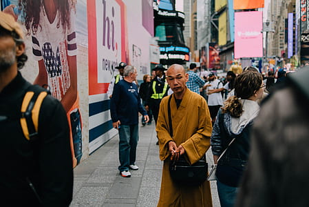 people on street between buildings at daytime thumbnail