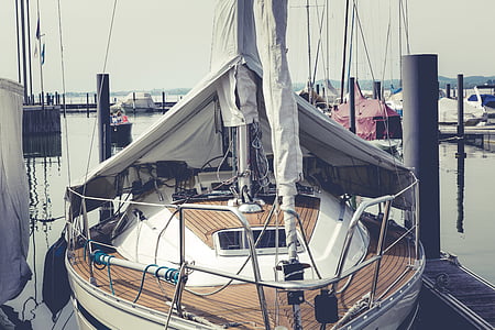 brown and white sail boat in dock thumbnail