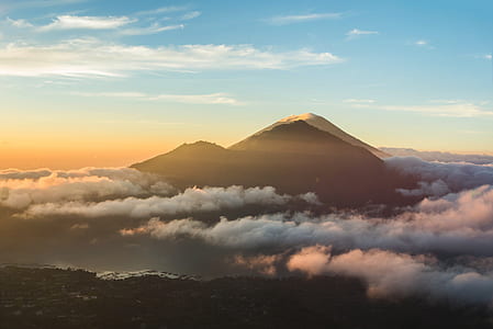 mountain summit above clouds during sunset thumbnail