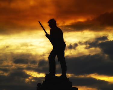 silhouette of man holding rifle thumbnail