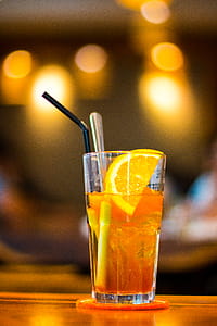 Macro Photography of Clear Drinking Glass With Lemon Fruit and Black Straw thumbnail