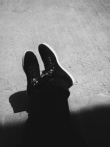 person in black suede sneakers thumbnail