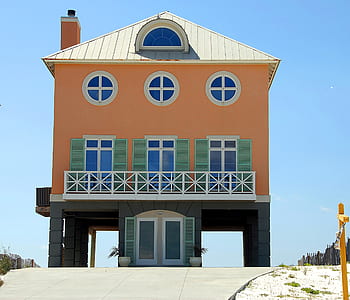 orange, teal, and black house thumbnail