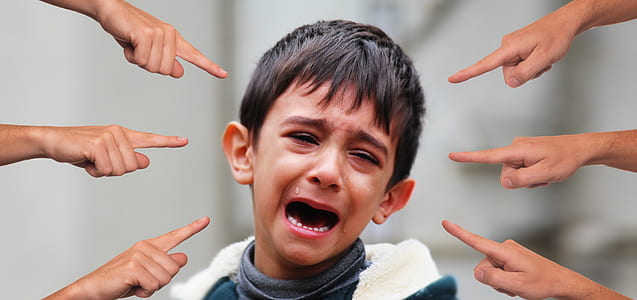 crying boy with six fingers pointing at him thumbnail
