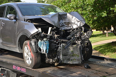 crashed gray vehicle on trailer thumbnail