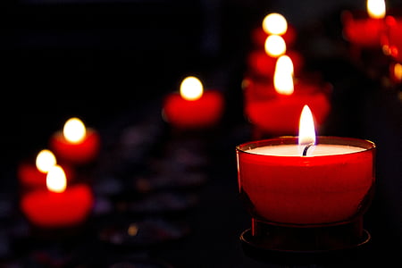 tilt-shift lens photography of a lit-up candle glass thumbnail