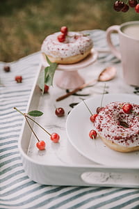 shallow focus photography of donut on ceramic plate thumbnail