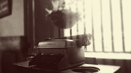 grayscale photography of typewriter thumbnail