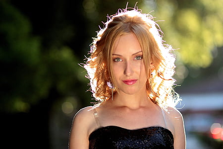 woman wearing black spaghetti strap dress thumbnail