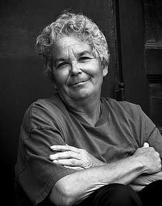 woman wearing t-shirt in greyscale portrait photography thumbnail