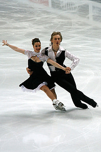 man and woman performing ice skating dance thumbnail