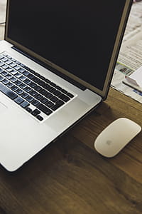Macbook Pro Beside the Apple Magic Mouse thumbnail