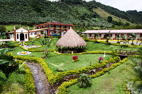 hut on green grass lawn thumbnail