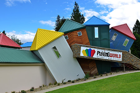 multicolored house near green tree thumbnail