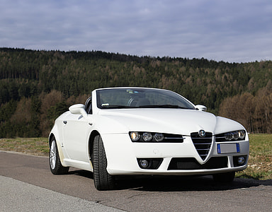 white Alfa Romeo Brera convertible coupe on road during daytime thumbnail