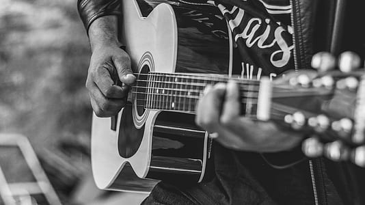 person playing acoustic guitar thumbnail