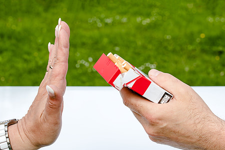 person holding flip-top cigarette box thumbnail