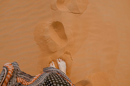 person's foot on brown soil thumbnail