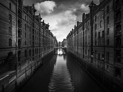grayscale photography of buildings and canal thumbnail