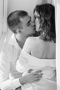 grayscasle photo of woman and man kissing thumbnail