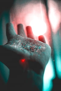 glitters on person's left hands thumbnail