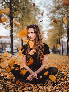 shallow focus photo of woman sitting outdoors thumbnail