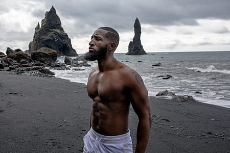 Man Wearing White Bottoms Near Body of Water thumbnail