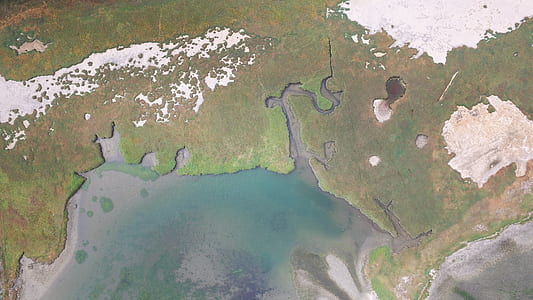 aerial view of land and body of water thumbnail